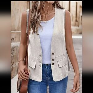 New apricot colored long 3 button vest with faux belt on back waist.  Size XS